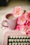 small image of a pink mug with coffee and pink flowers